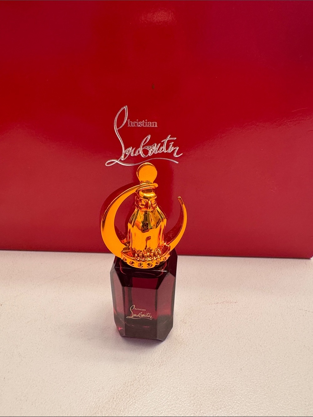 Christian Louboutin Red Glass Fragrance Bottle with Gold Crescent Cap